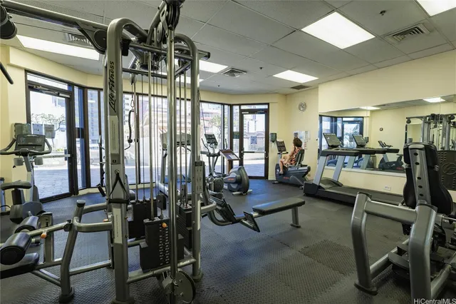 a view of a livingroom with furniture and floor to ceiling window