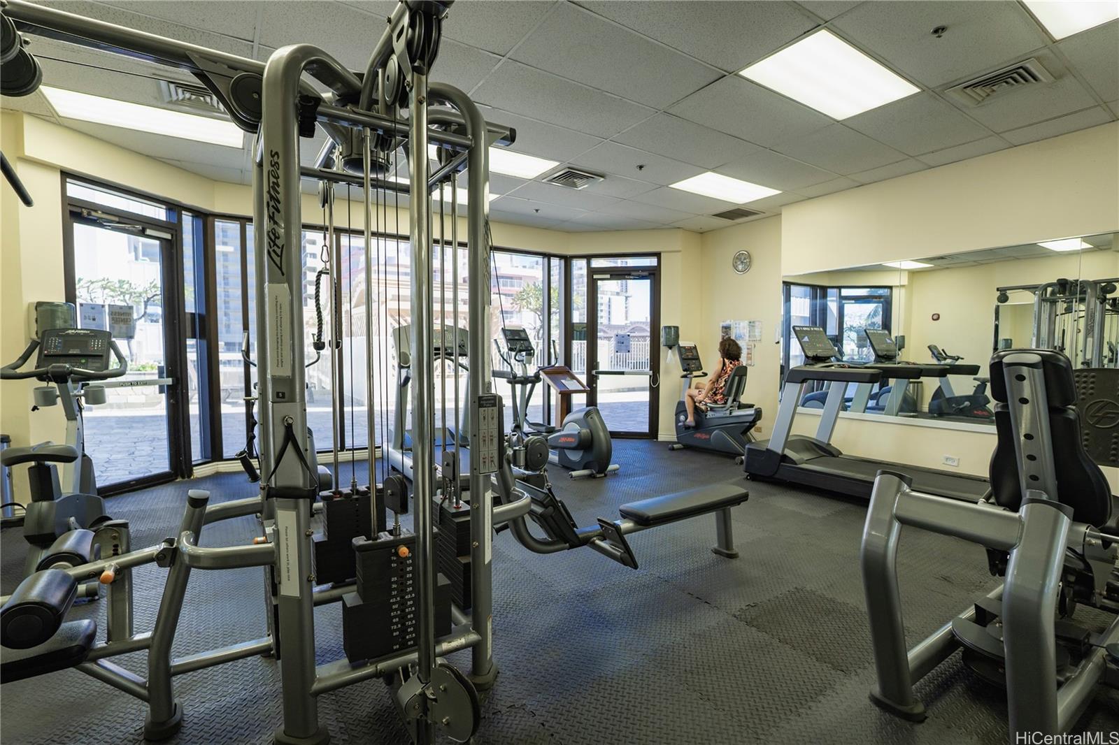 445 Seaside Avenue, Unit 2006 Honolulu, HI 96815 - Photo 15 of 23 a view of a livingroom with furniture and floor to ceiling window