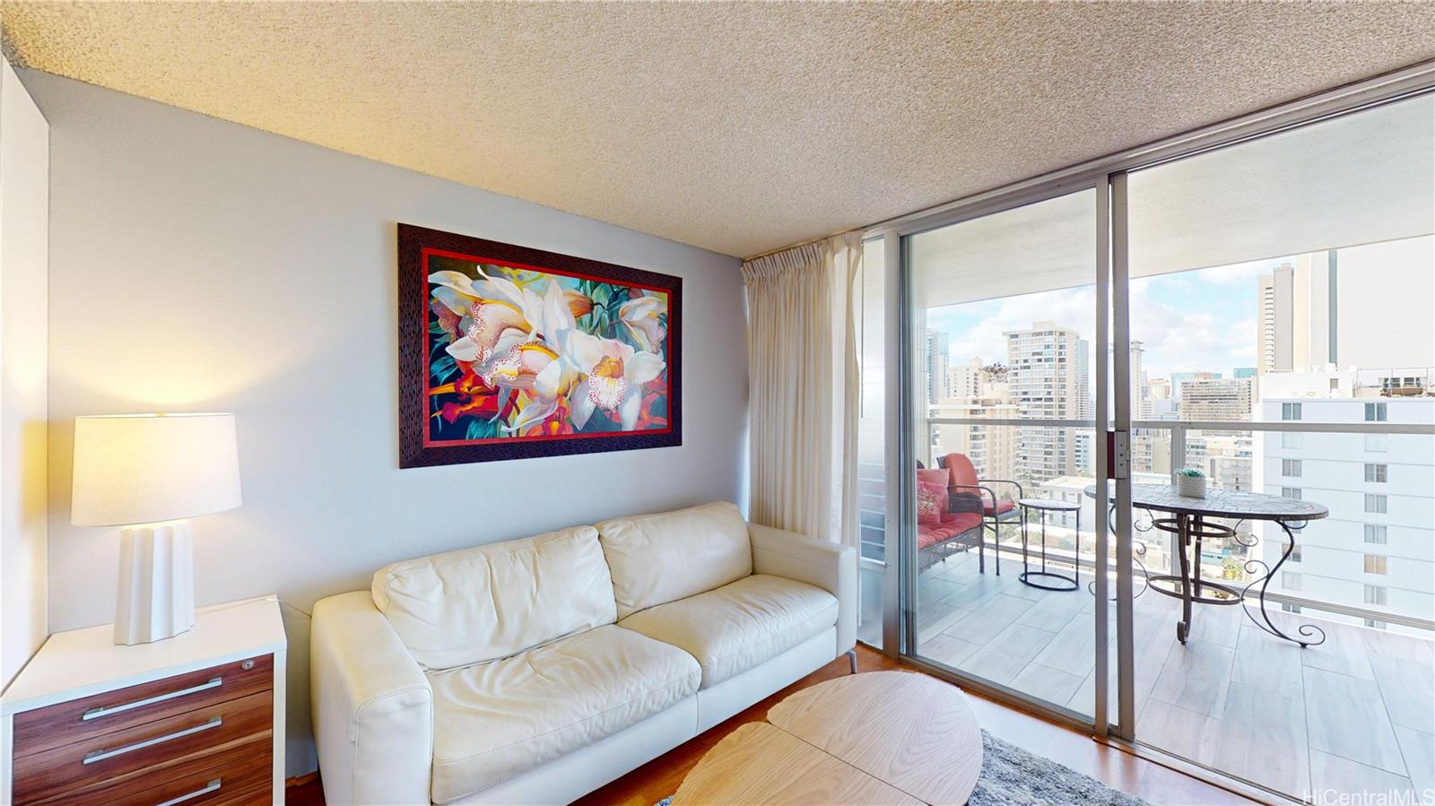 445 Seaside Avenue, Unit 2006 Honolulu, HI 96815 - Photo 2 of 23 a living room with furniture and a large window