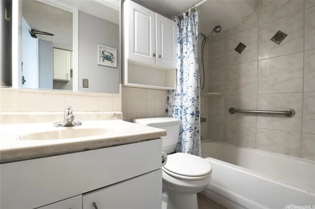 a bathroom with a sink a toilet and a bathtub