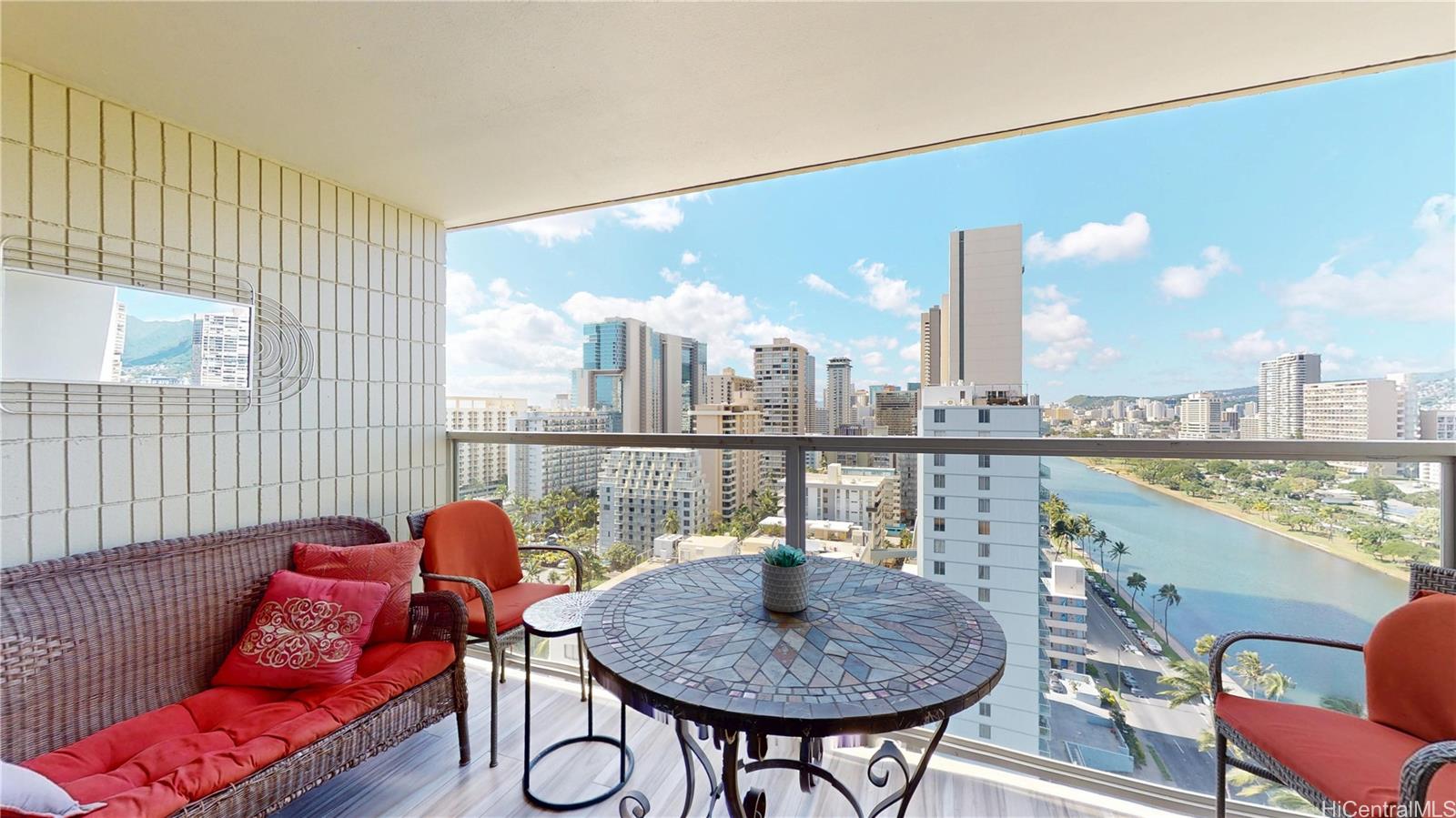 445 Seaside Avenue, Unit 2006 Honolulu, HI 96815 - Photo 10 of 23 a living room with furniture and a floor to ceiling window