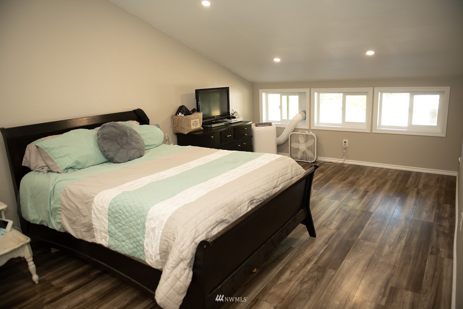 650-38 Logan Hill Road Chehalis, WA 98532 - Photo 19 of 36 a bedroom with a bed and wooden floor