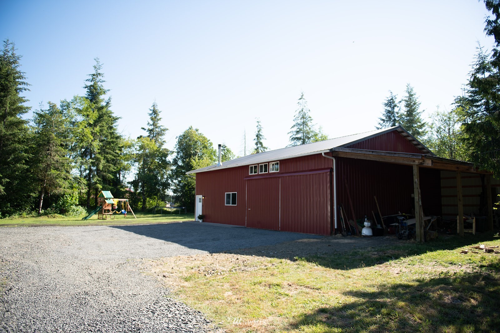 650-38 Logan Hill Road Chehalis, WA 98532 - Photo 2 of 36 a view of a barn with yard and wooden fence