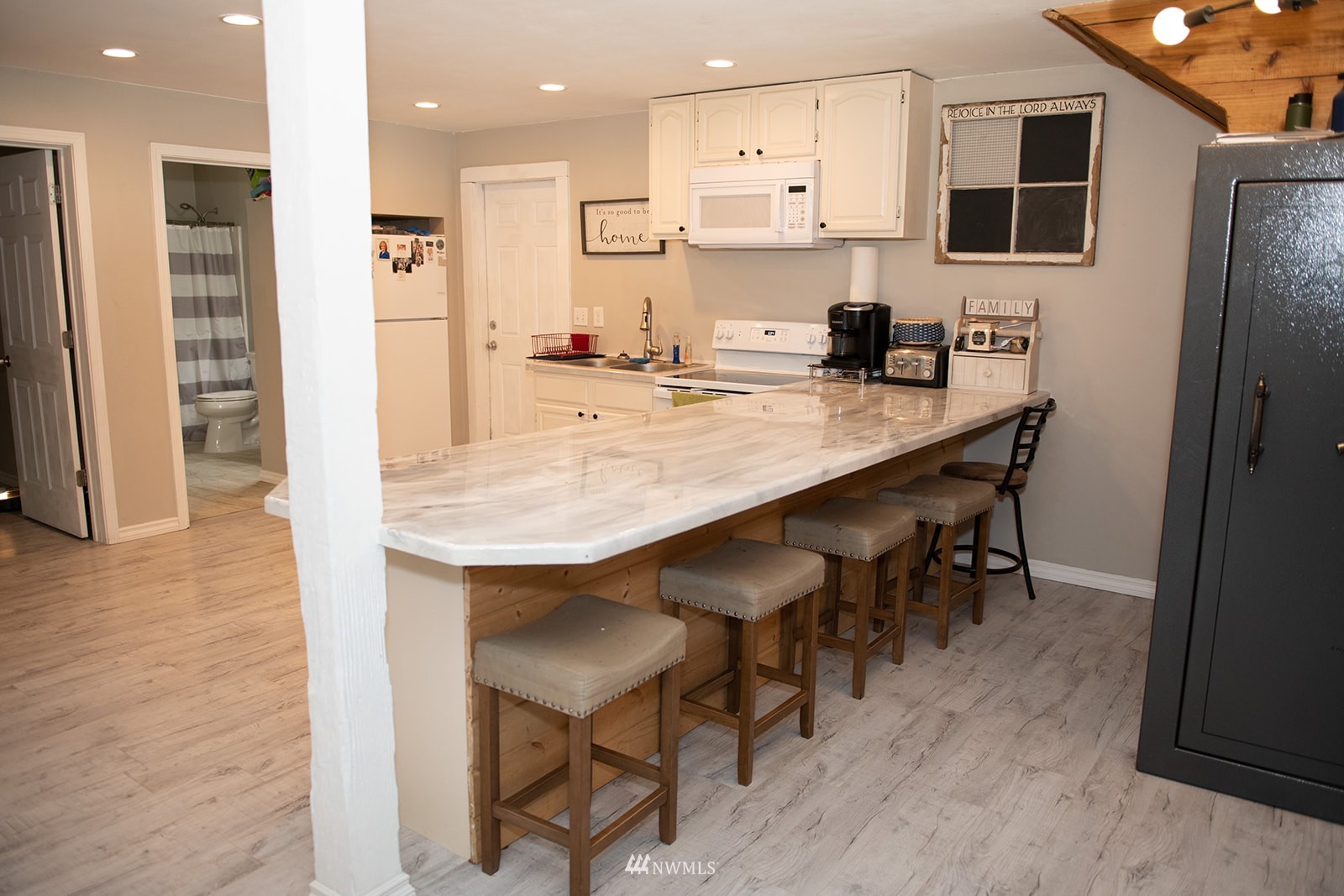 650-38 Logan Hill Road Chehalis, WA 98532 - Photo 7 of 36 a kitchen with stainless steel appliances refrigerator wooden floor dining table and chairs