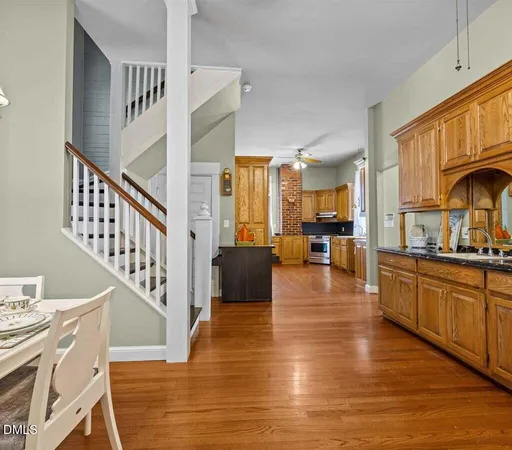 a view of an empty room fire place and a livingroom