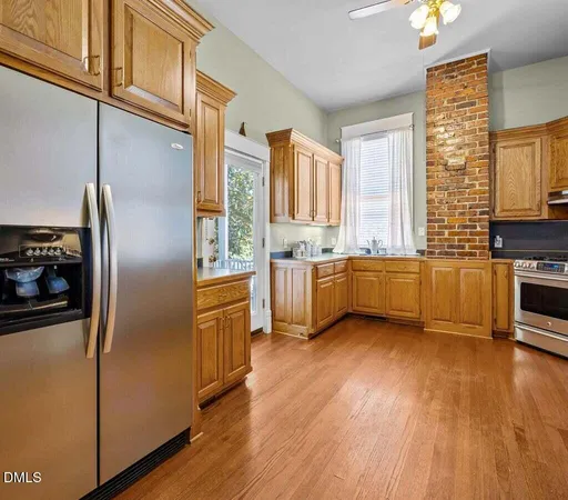 a bathroom with a sink mirror and toilet