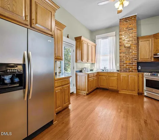 a bathroom with a sink mirror and toilet