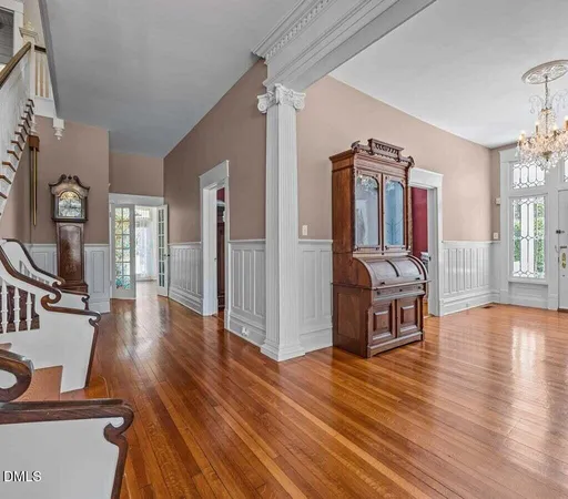 a view of a room with wooden floor