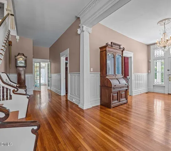 a view of a room with wooden floor