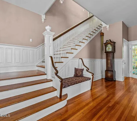 a front view of a house with a yard outdoor seating and garage