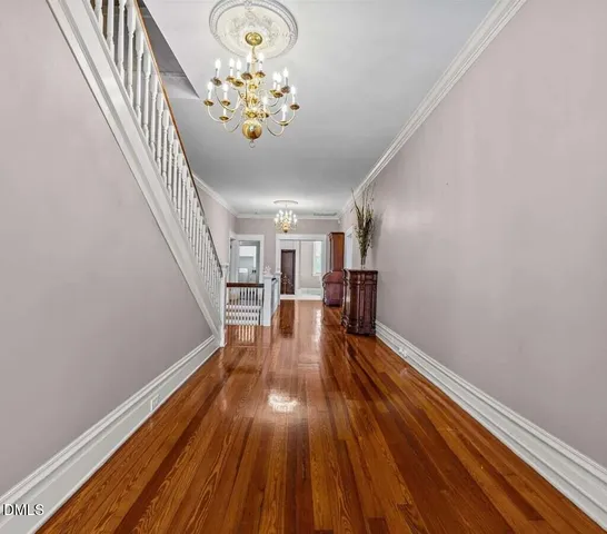 a view of a patio with couches table and chairs and potted plants