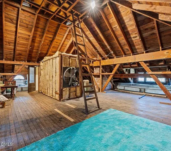 an aerial view of a house with a yard and garden