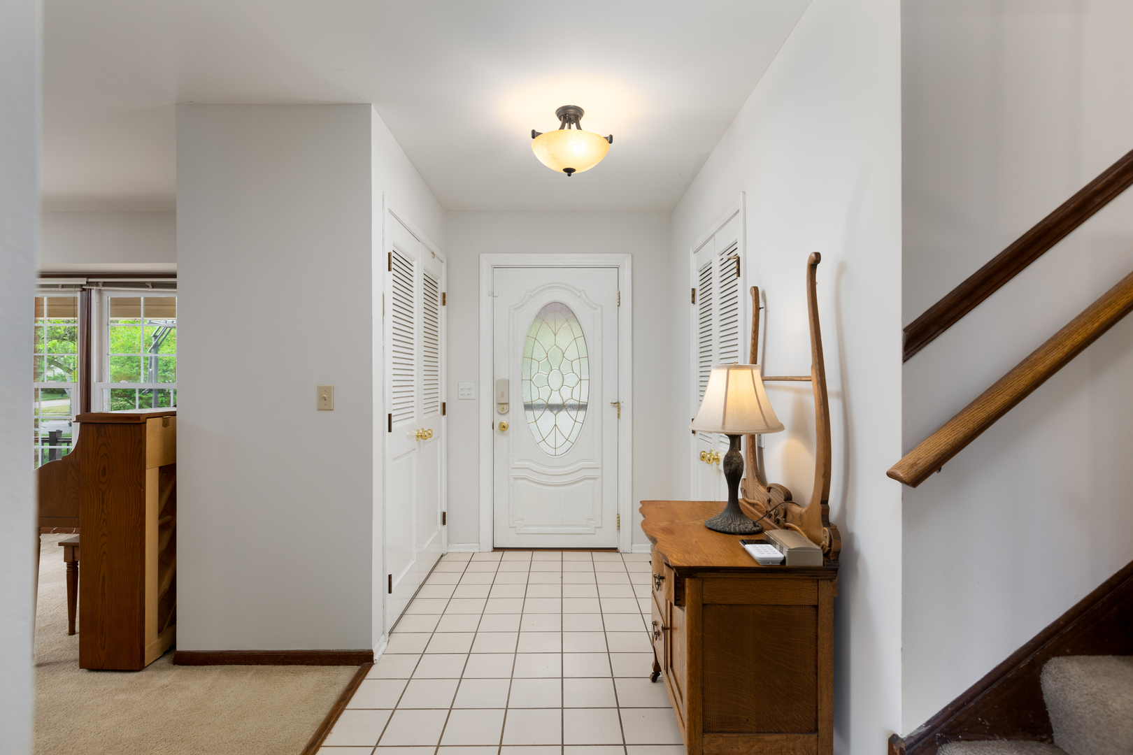 1616 Apache Drive Naperville, IL 60563 - Photo 14 of 36 a view of a hallway to a livingroom with furniture wooden floor and window