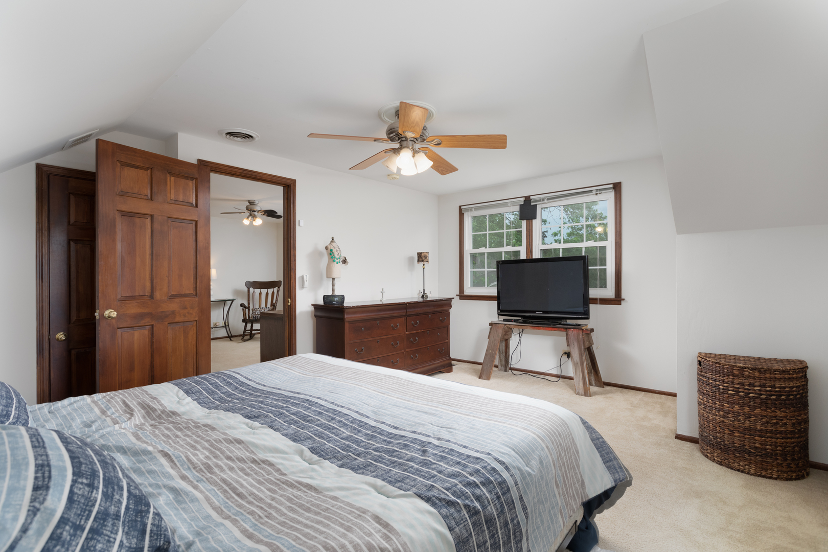 1616 Apache Drive Naperville, IL 60563 - Photo 21 of 36 a bedroom with a bed and a flat screen tv