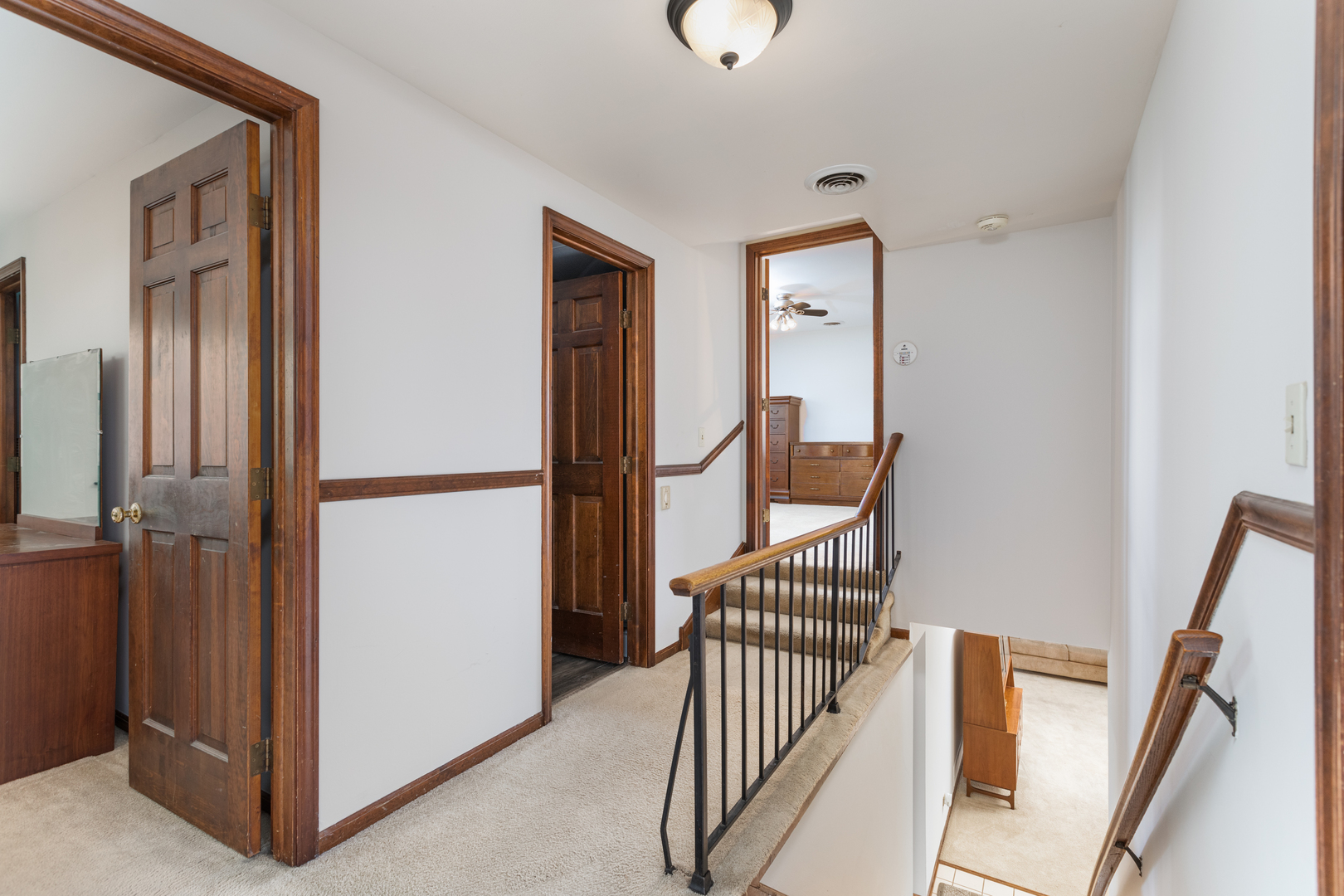1616 Apache Drive Naperville, IL 60563 - Photo 26 of 36 a view of a hallway with wooden floor and staircase