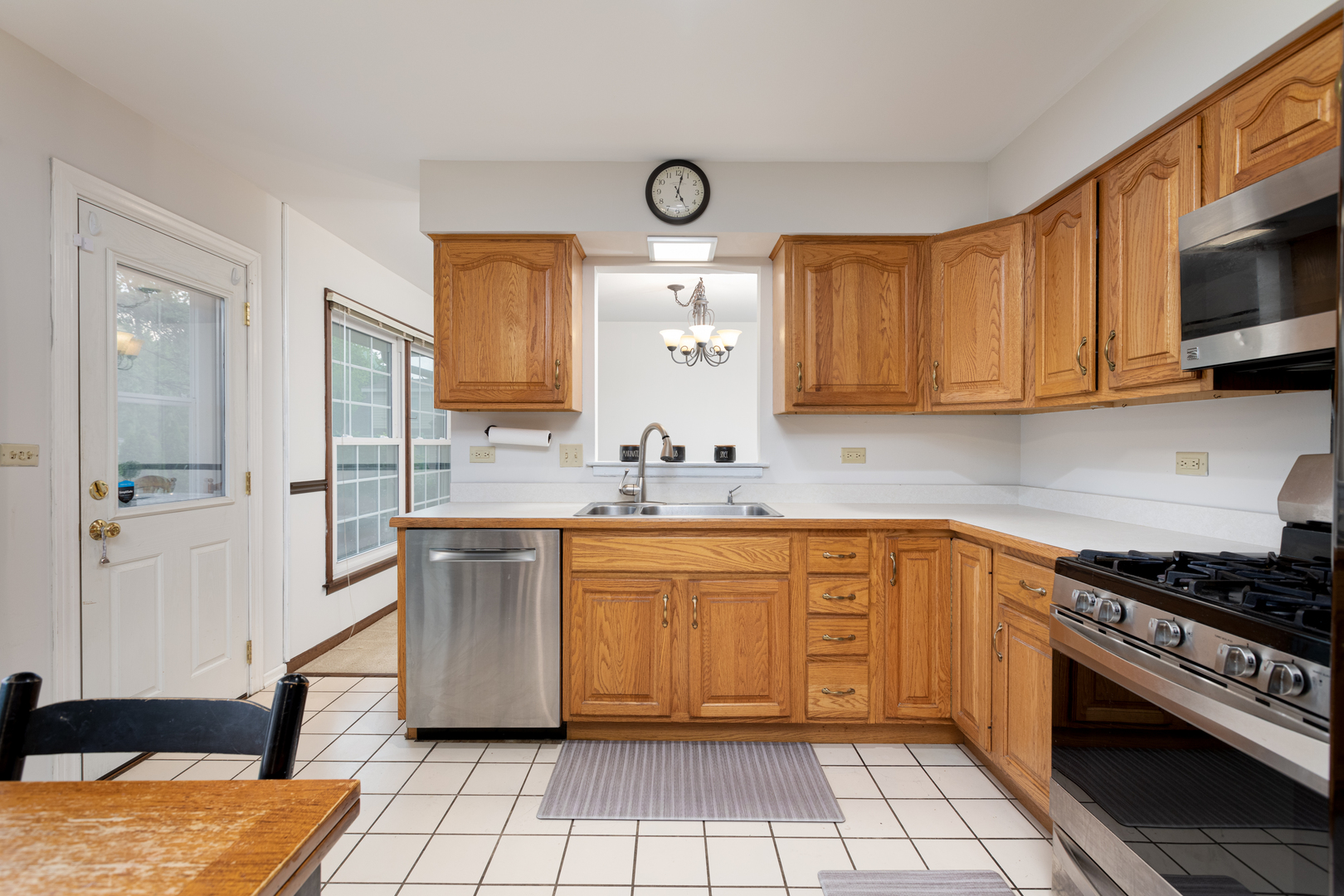 1616 Apache Drive Naperville, IL 60563 - Photo 3 of 36 a kitchen with stainless steel appliances granite countertop a sink and cabinets