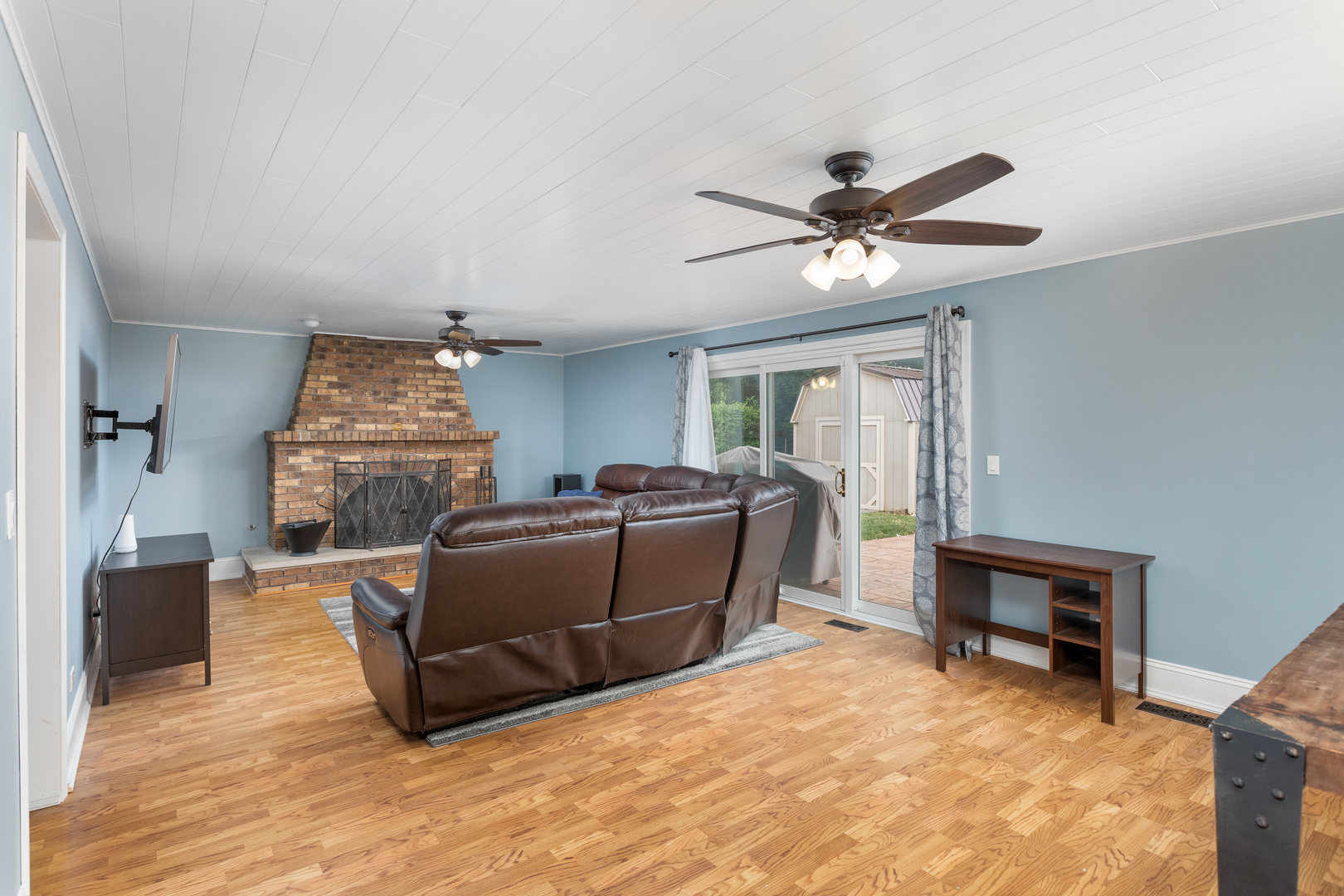 1616 Apache Drive Naperville, IL 60563 - Photo 7 of 36 a living room with furniture and a ceiling fan