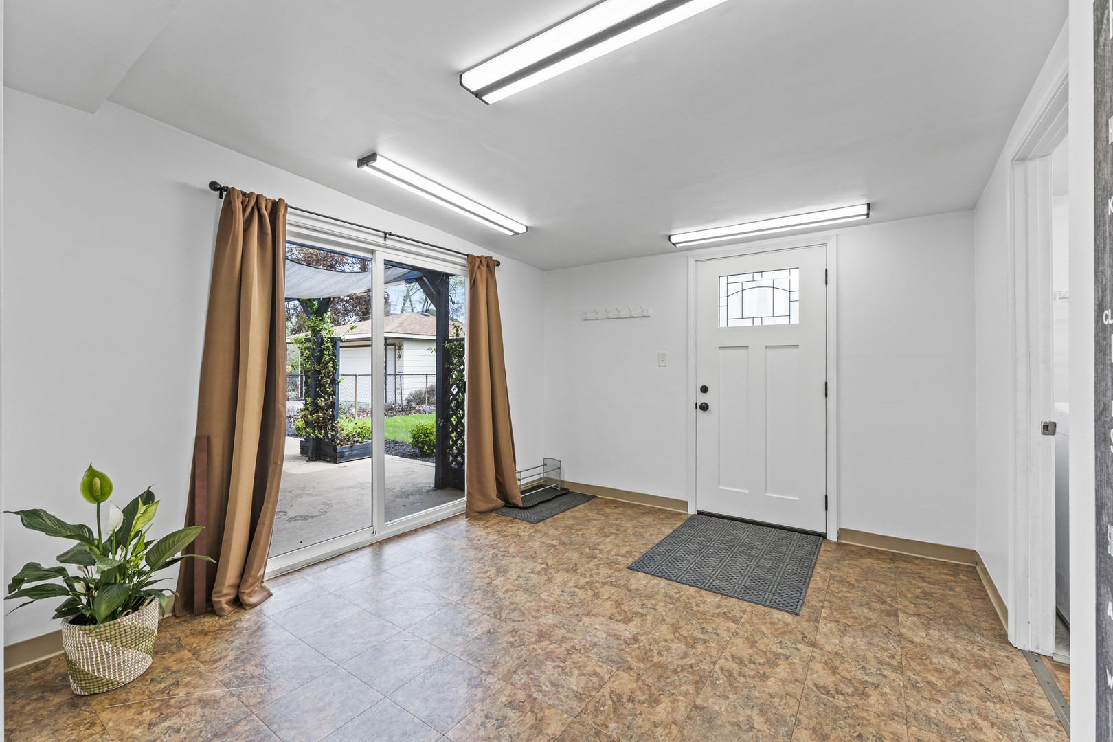439 Highview Avenue Elmhurst, IL 60126 - Photo 23 of 42 a view of an entryway with wooden floor and a potted plant