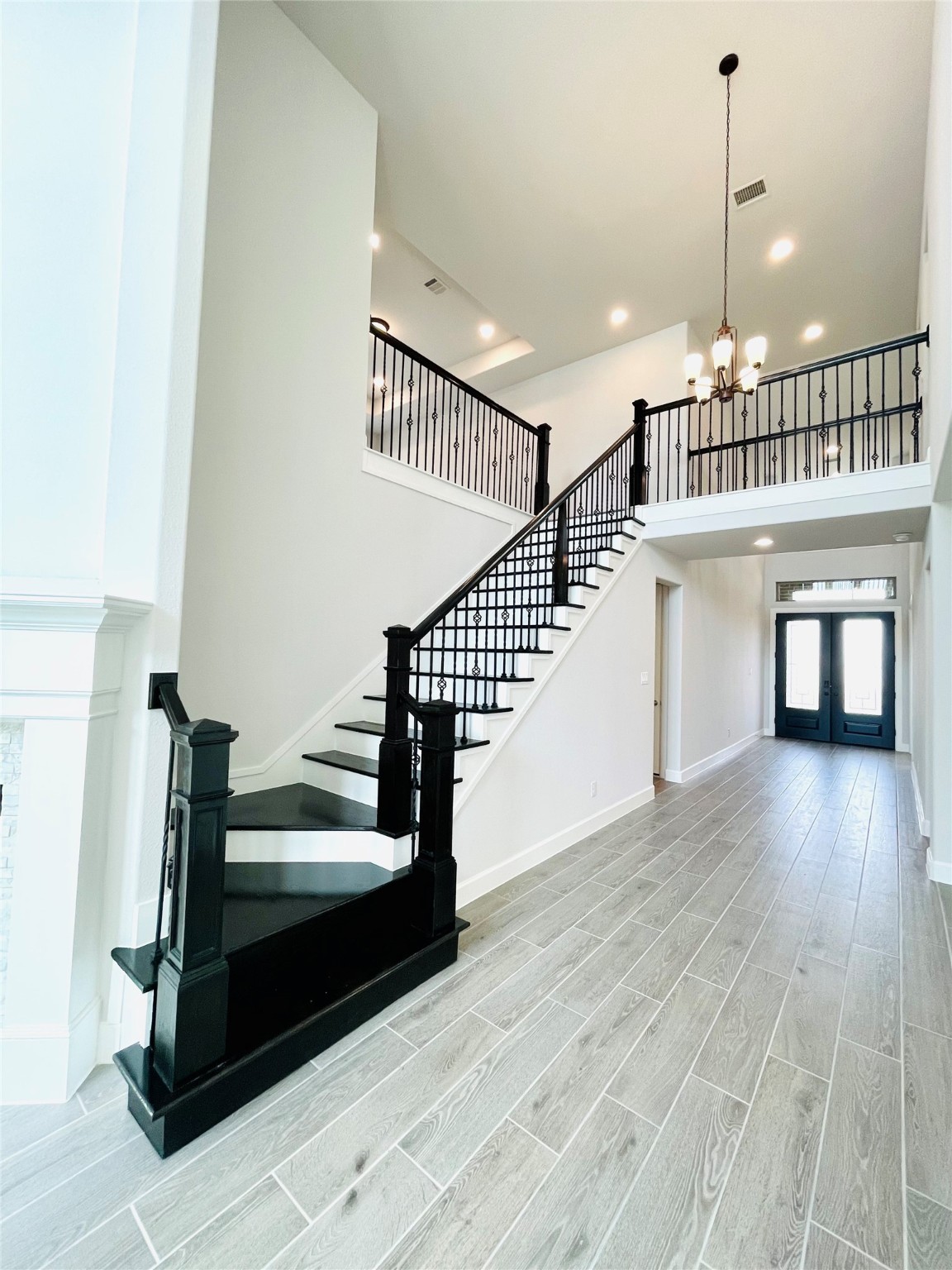 596 Santa Rosa Hls Drive Katy, TX 77493 - Photo 17 of 45 a view of entryway and hall with wooden floor