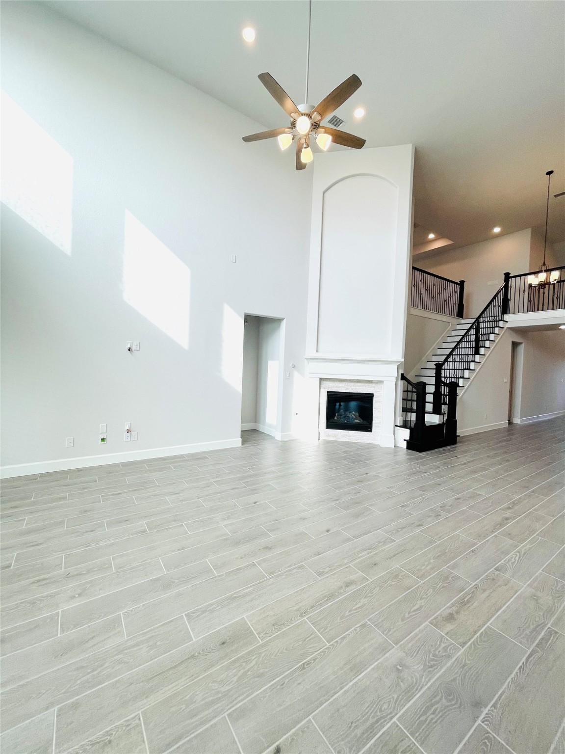 596 Santa Rosa Hls Drive Katy, TX 77493 - Photo 20 of 45 an empty room with windows and fireplace