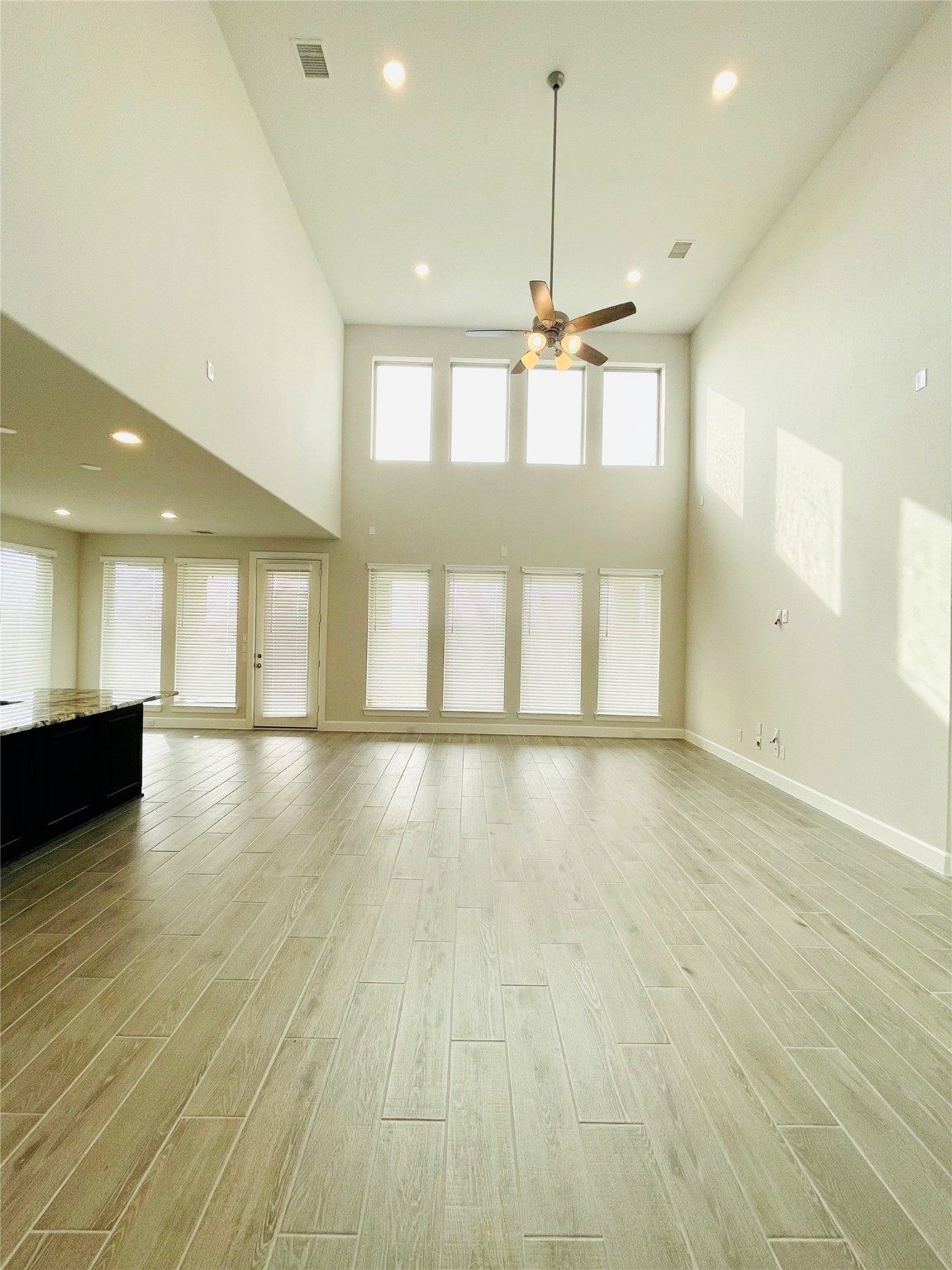 596 Santa Rosa Hls Drive Katy, TX 77493 - Photo 21 of 45 a view of an empty room with wooden floor and a window