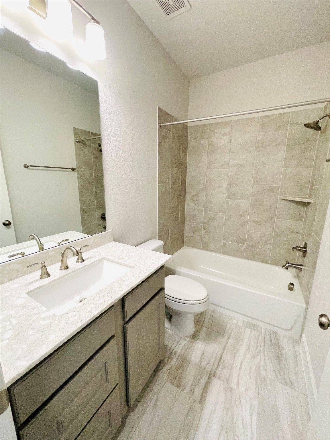 596 Santa Rosa Hls Drive Katy, TX 77493 - Photo 36 of 45 a bathroom with a granite countertop sink toilet and shower