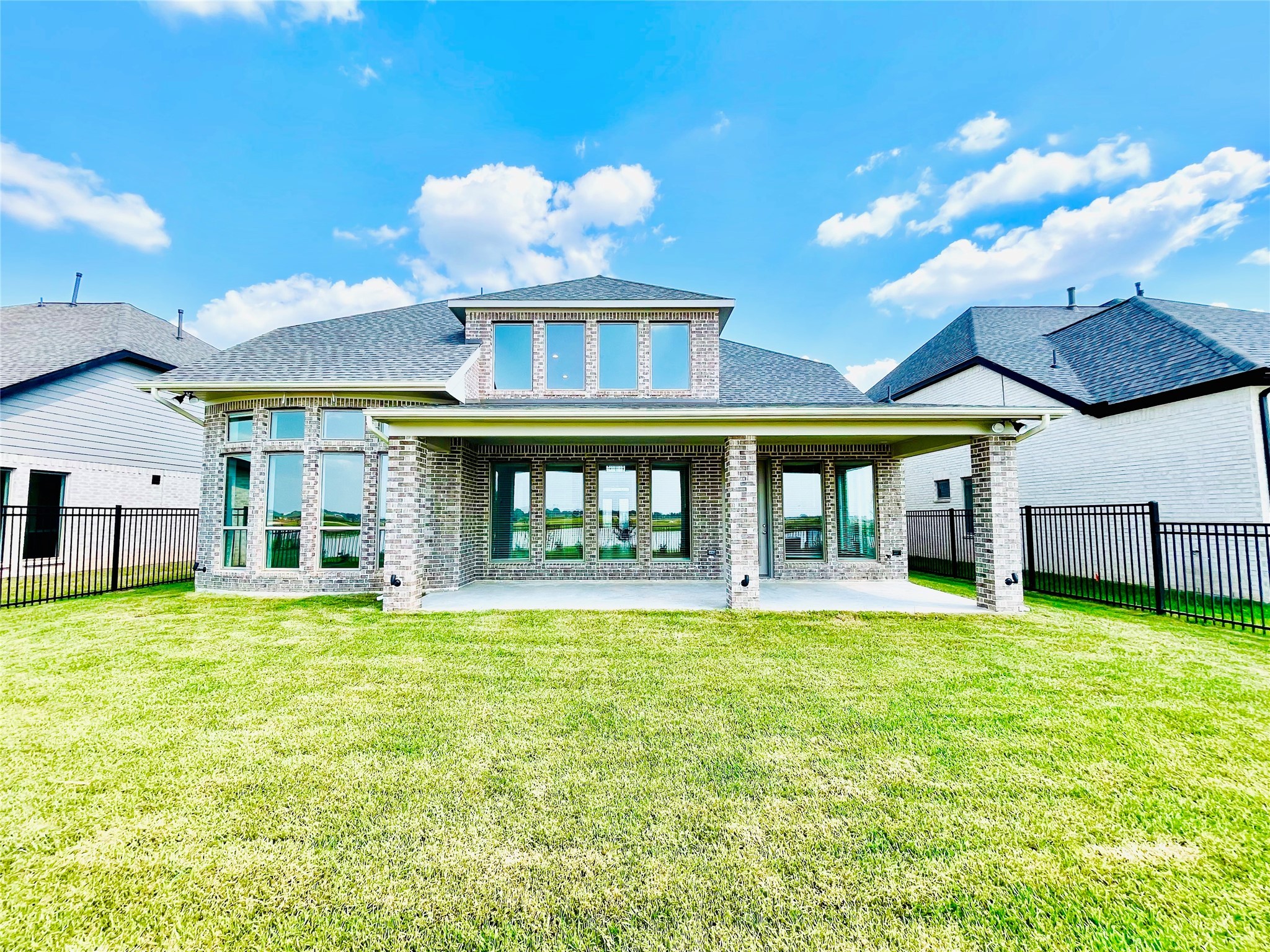 596 Santa Rosa Hls Drive Katy, TX 77493 - Photo 40 of 45 a view of a large pool with a fireplace and a large window