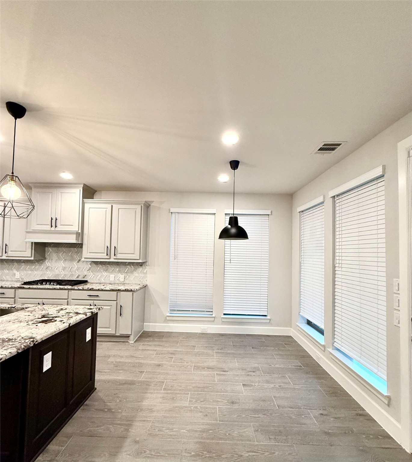 596 Santa Rosa Hls Drive Katy, TX 77493 - Photo 9 of 45 a large kitchen with stainless steel appliances granite countertop a sink and cabinets