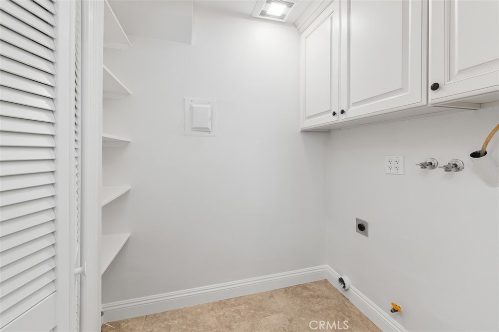 33431 Nottingham Way, Unit A Dana Point, CA 92629 - Photo 5 of 15 Laundry room with extra storage off the kitchen.