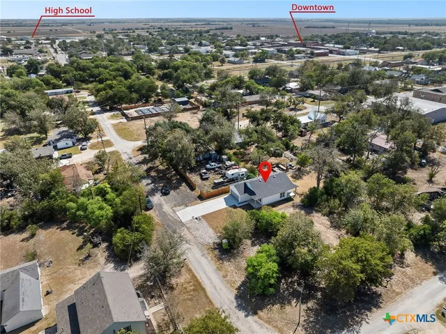 an aerial view of residential houses with outdoor space
