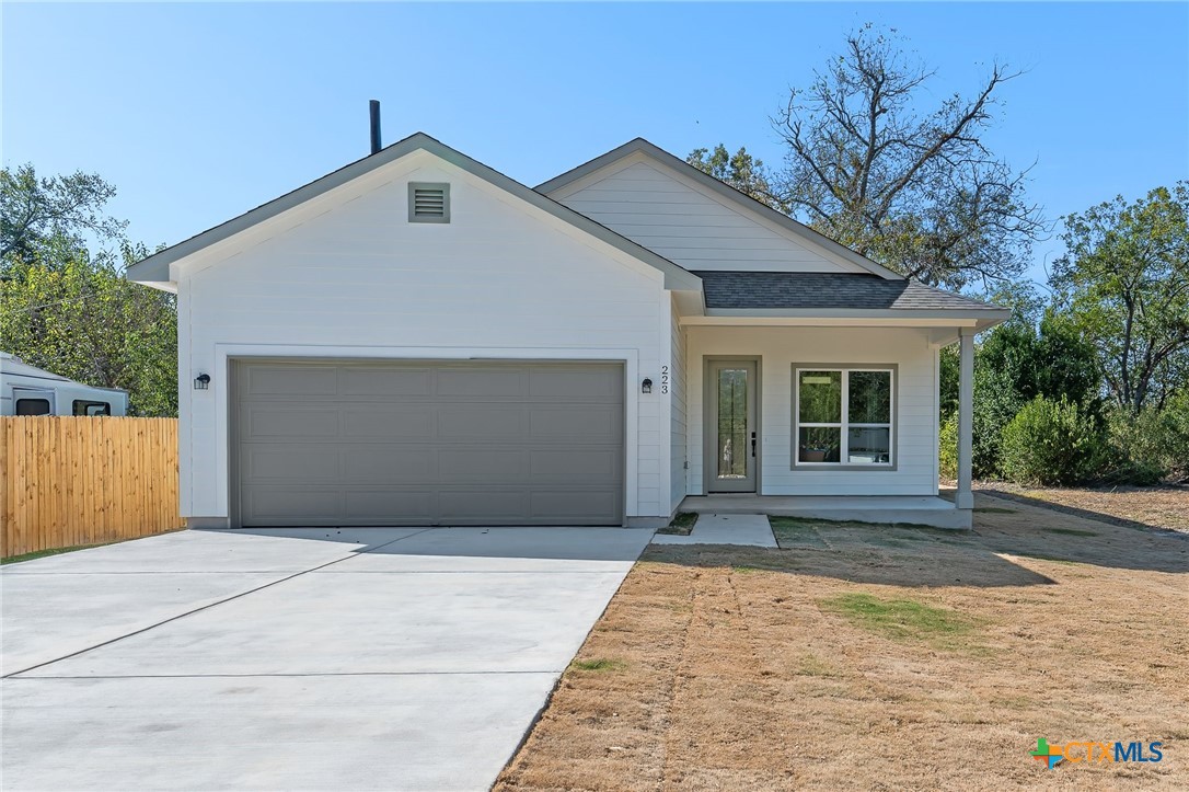 223 Allen Street Bartlett, TX 76511 - Photo 2 of 21 a front view of a house with a garage