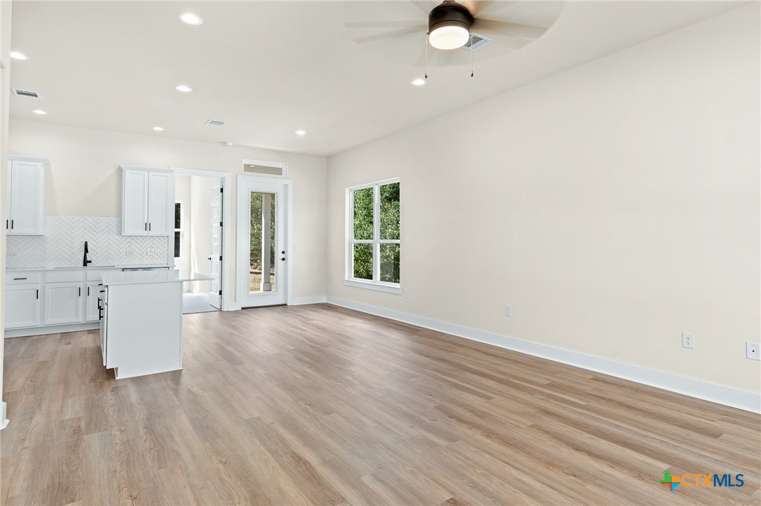 223 Allen Street Bartlett, TX 76511 - Photo 5 of 21 a view of kitchen with furniture and wooden floor
