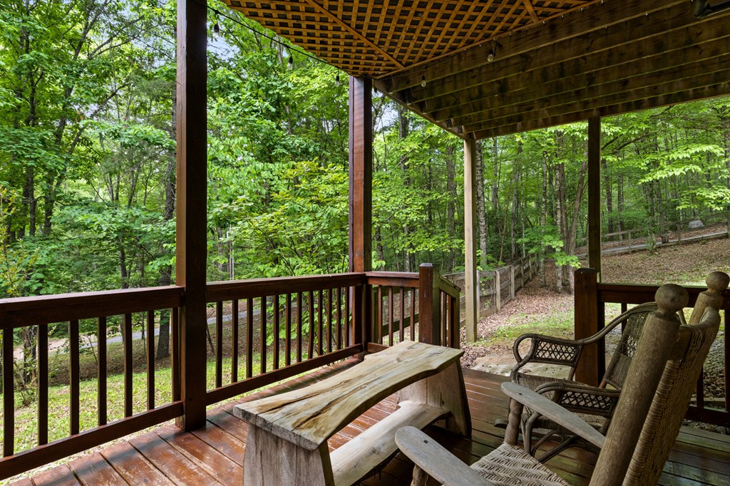 220 Solar Drive Blue Ridge, GA 30513 - Photo 51 of 59 a view of a balcony with chairs and wooden fence
