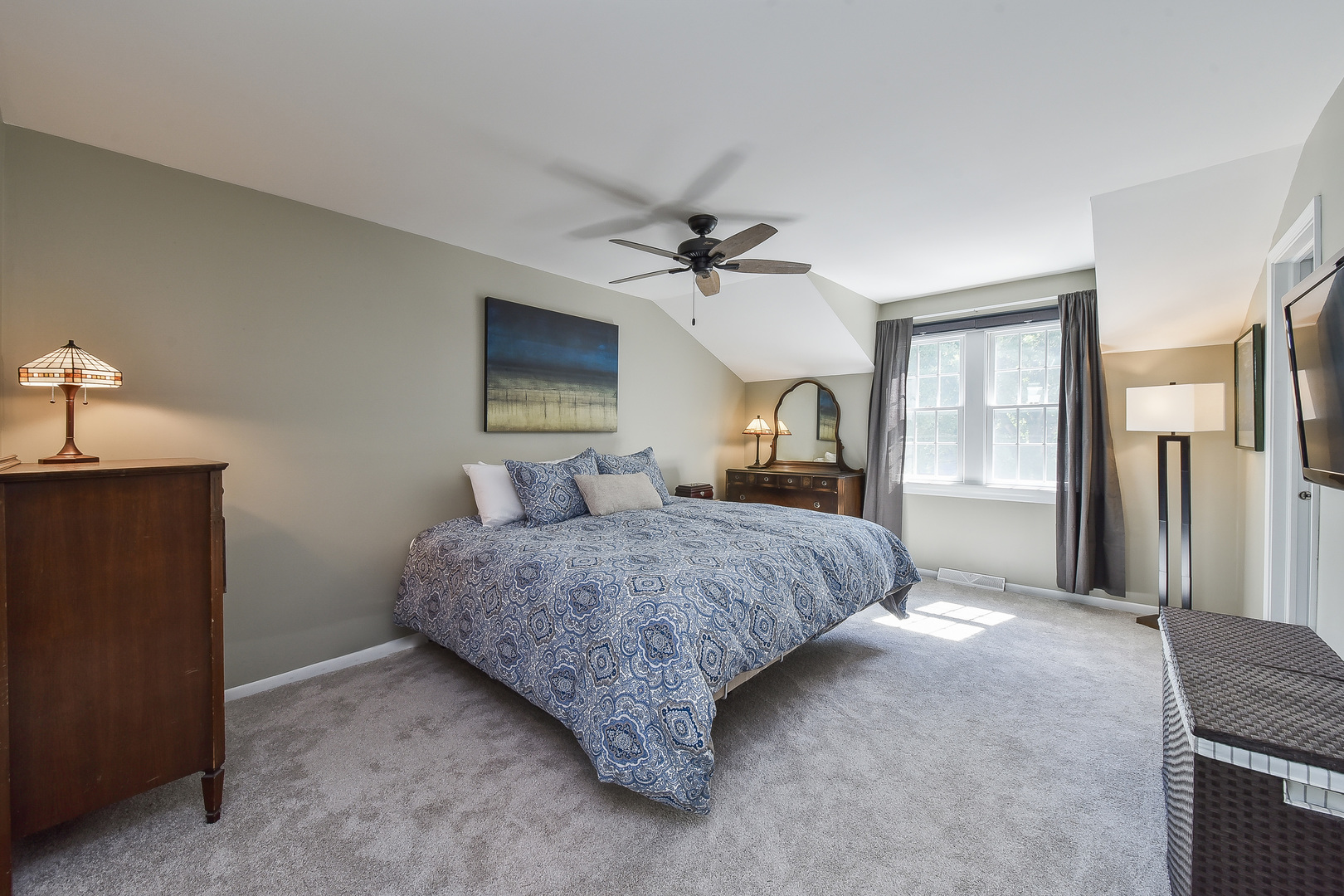 18 Wakefield Lane Geneva, IL 60134 - Photo 12 of 23 a spacious bedroom with a bed mirror and window