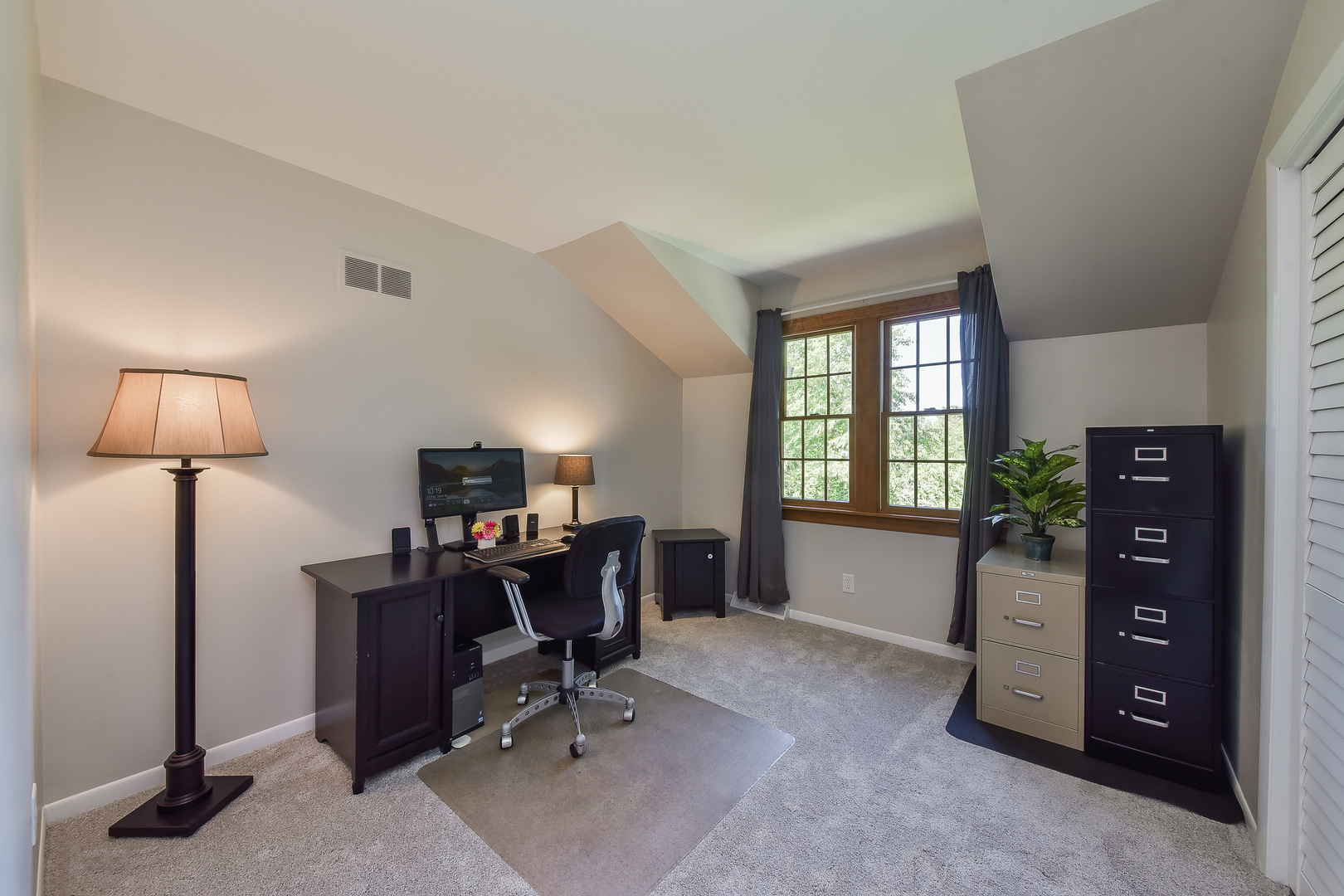 18 Wakefield Lane Geneva, IL 60134 - Photo 15 of 23 a view of a workspace with furniture and a window