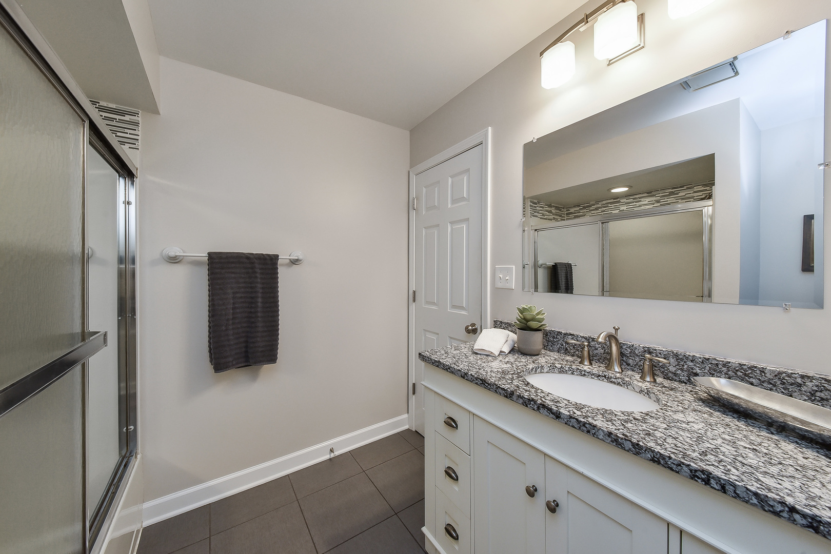 18 Wakefield Lane Geneva, IL 60134 - Photo 18 of 23 a bathroom with a granite countertop sink and mirror
