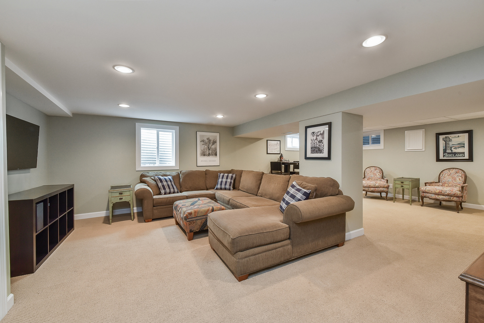 18 Wakefield Lane Geneva, IL 60134 - Photo 19 of 23 a living room with furniture flat screen tv and a fireplace
