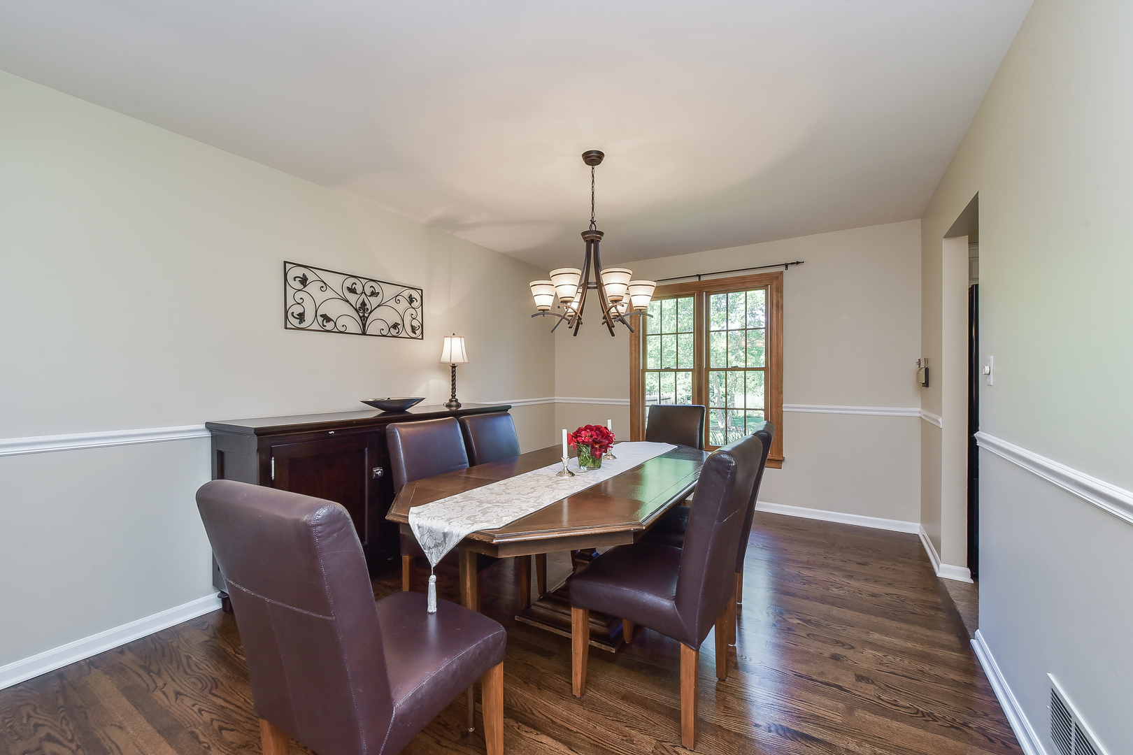 18 Wakefield Lane Geneva, IL 60134 - Photo 5 of 23 a view of a dining room with furniture window and wooden floor