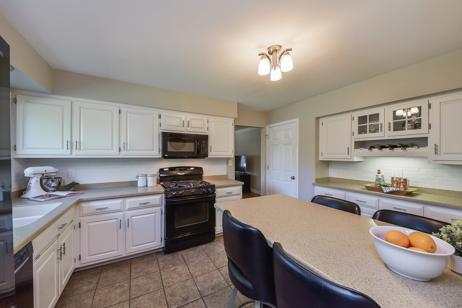 18 Wakefield Lane Geneva, IL 60134 - Photo 6 of 23 a kitchen with stainless steel appliances granite countertop a sink stove and cabinets