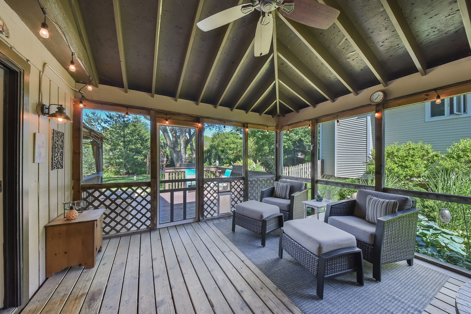 18 Wakefield Lane Geneva, IL 60134 - Photo 9 of 23 a balcony with furniture and wooden floor