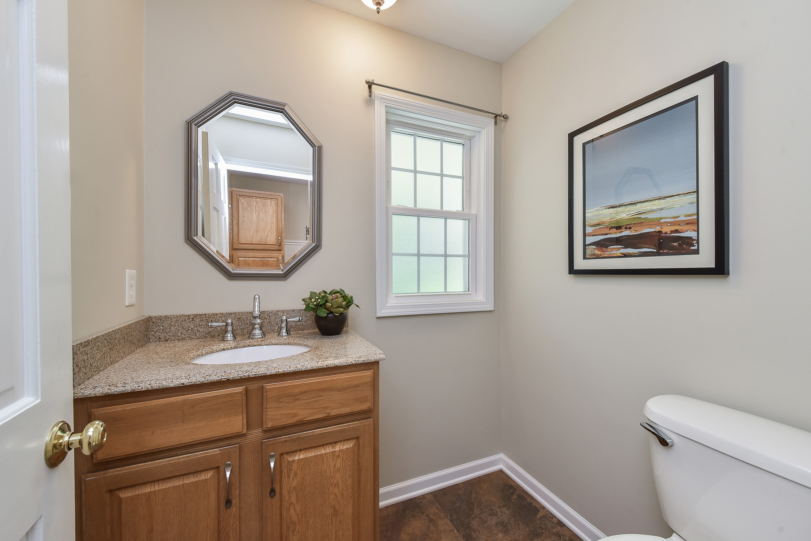 18 Wakefield Lane Geneva, IL 60134 - Photo 10 of 23 a bathroom with a toilet sink and mirror