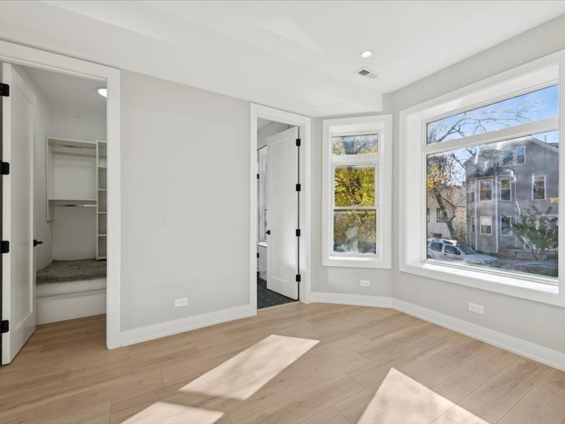2818 West Fletcher Street, Unit 1 Chicago, IL 60618 - Photo 10 of 18 a view of an empty room with a window