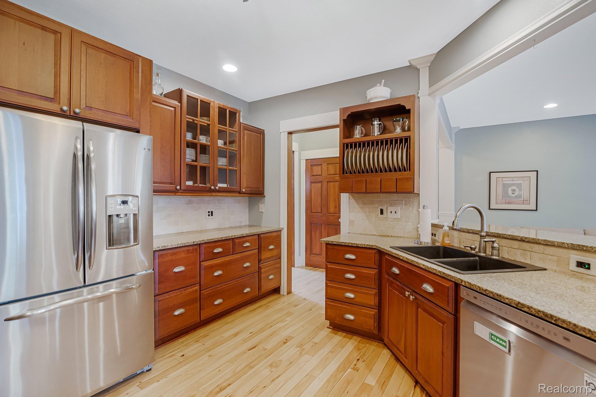 5412 Vines Road Howell, MI 48843 - Photo 12 of 47 Kitchen is open to great room with large breakfast bar.