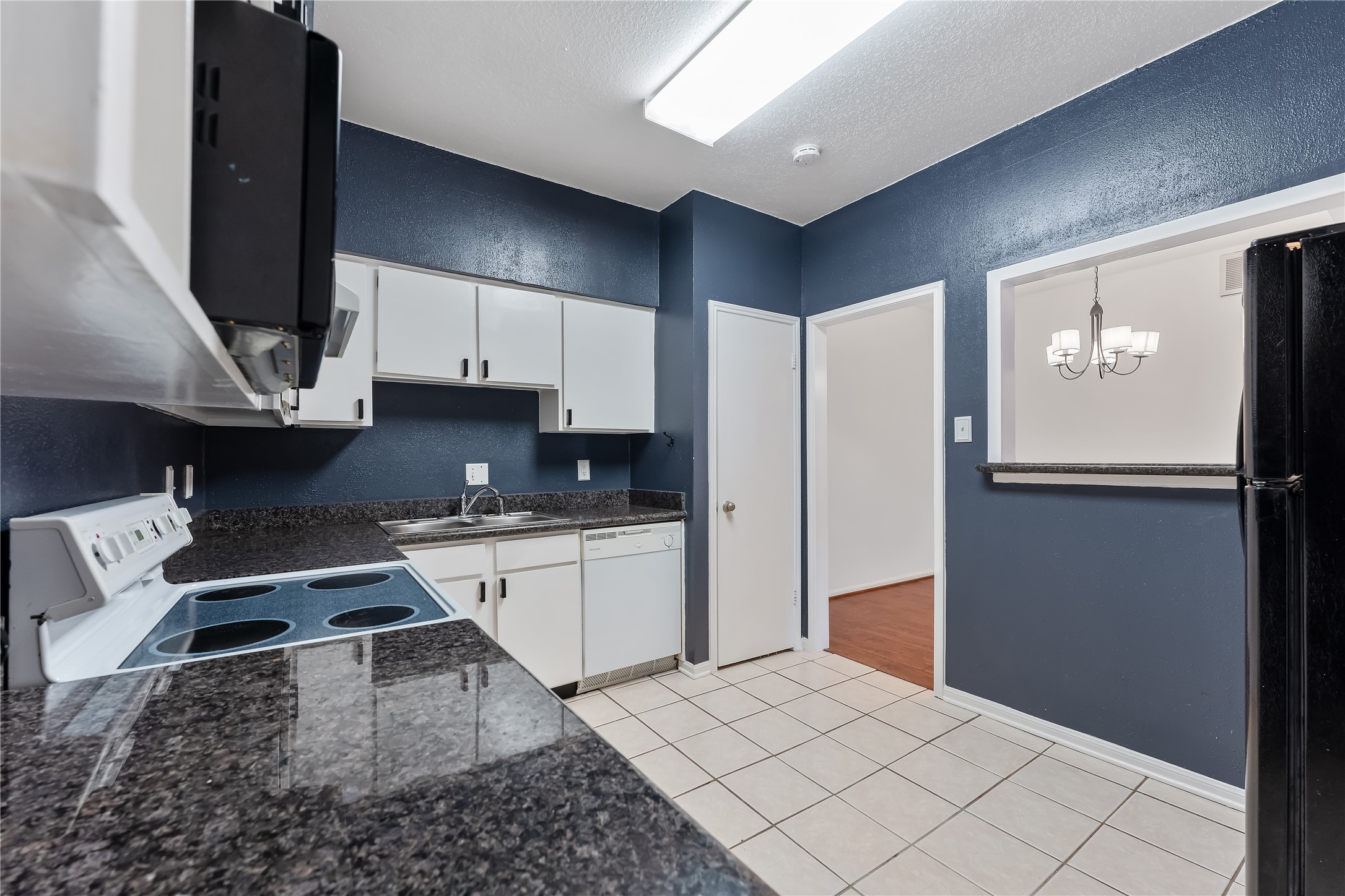 2100 Tanglewilde Street, Unit 330 Houston, TX 77063 - Photo 12 of 22 a kitchen with a refrigerator sink and stove