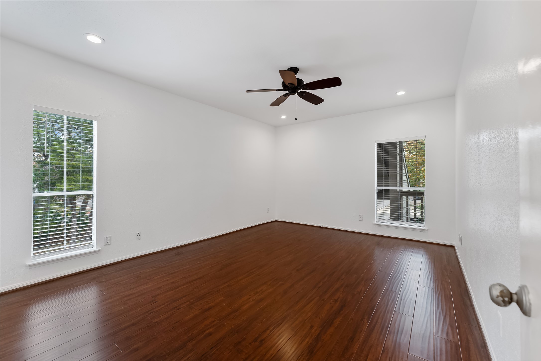 2100 Tanglewilde Street, Unit 330 Houston, TX 77063 - Photo 14 of 22 a view of empty room with wooden floor and fan