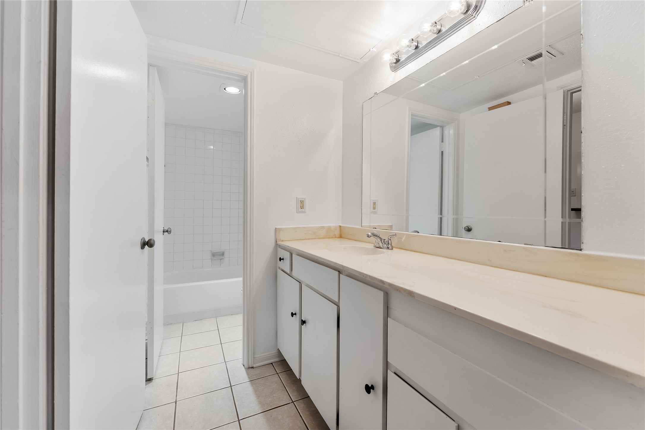 2100 Tanglewilde Street, Unit 330 Houston, TX 77063 - Photo 17 of 22 a bathroom with a sink and a mirror