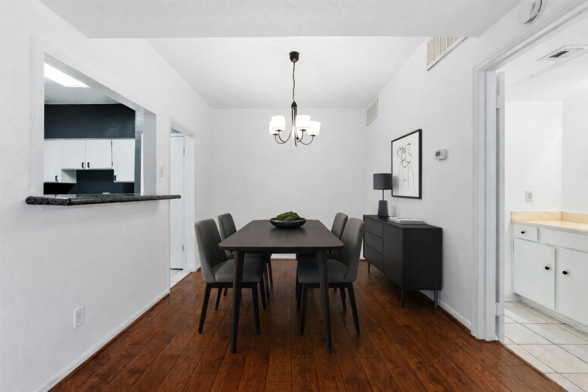 2100 Tanglewilde Street, Unit 330 Houston, TX 77063 - Photo 2 of 22 a view of a dining room with furniture and wooden floor