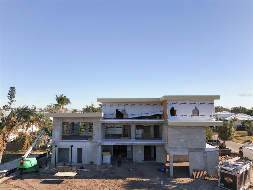 581 Hibiscus Way Longboat Key, FL 34228 - Photo 11 of 12 a view of a building with many windows