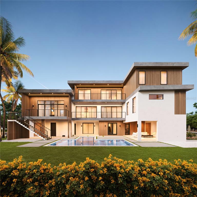 581 Hibiscus Way Longboat Key, FL 34228 - Photo 2 of 12 a front view of a house with a yard