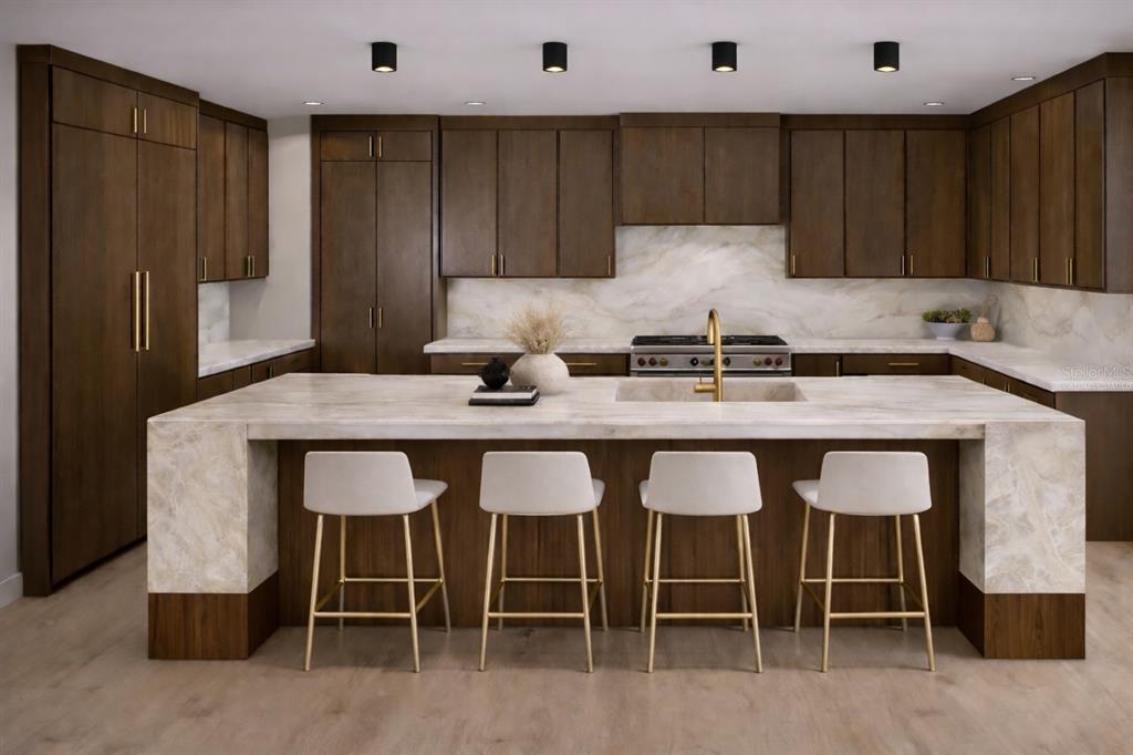 581 Hibiscus Way Longboat Key, FL 34228 - Photo 4 of 12 a kitchen with granite countertop a table chairs sink and cabinets